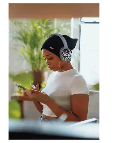 Girl on the phone with black and white headphone sticker