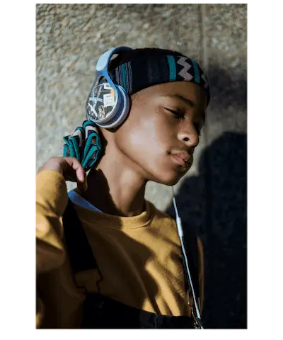 Guy listening to music in custom headphone wrap